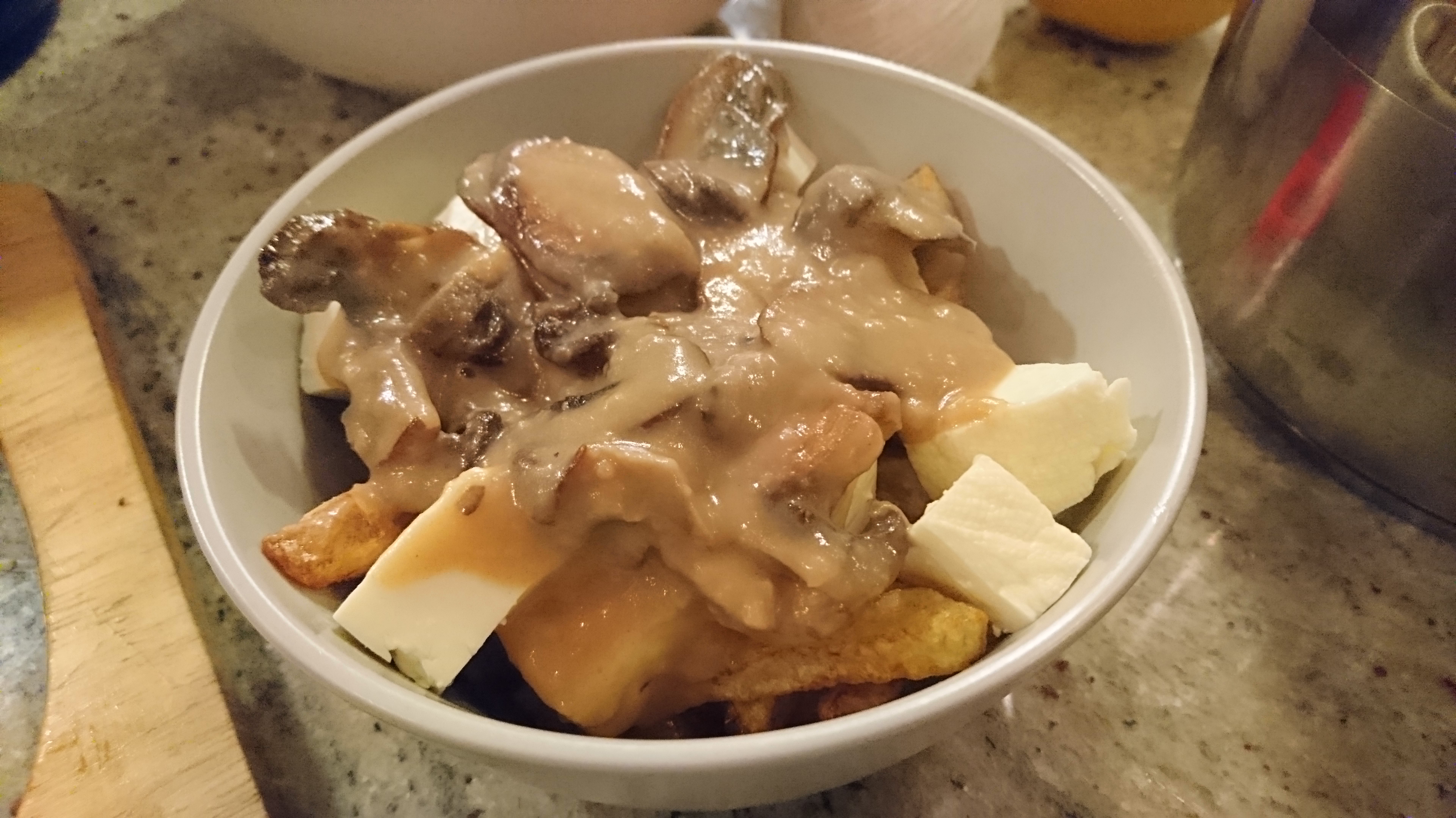 a bowl of homemade poutine