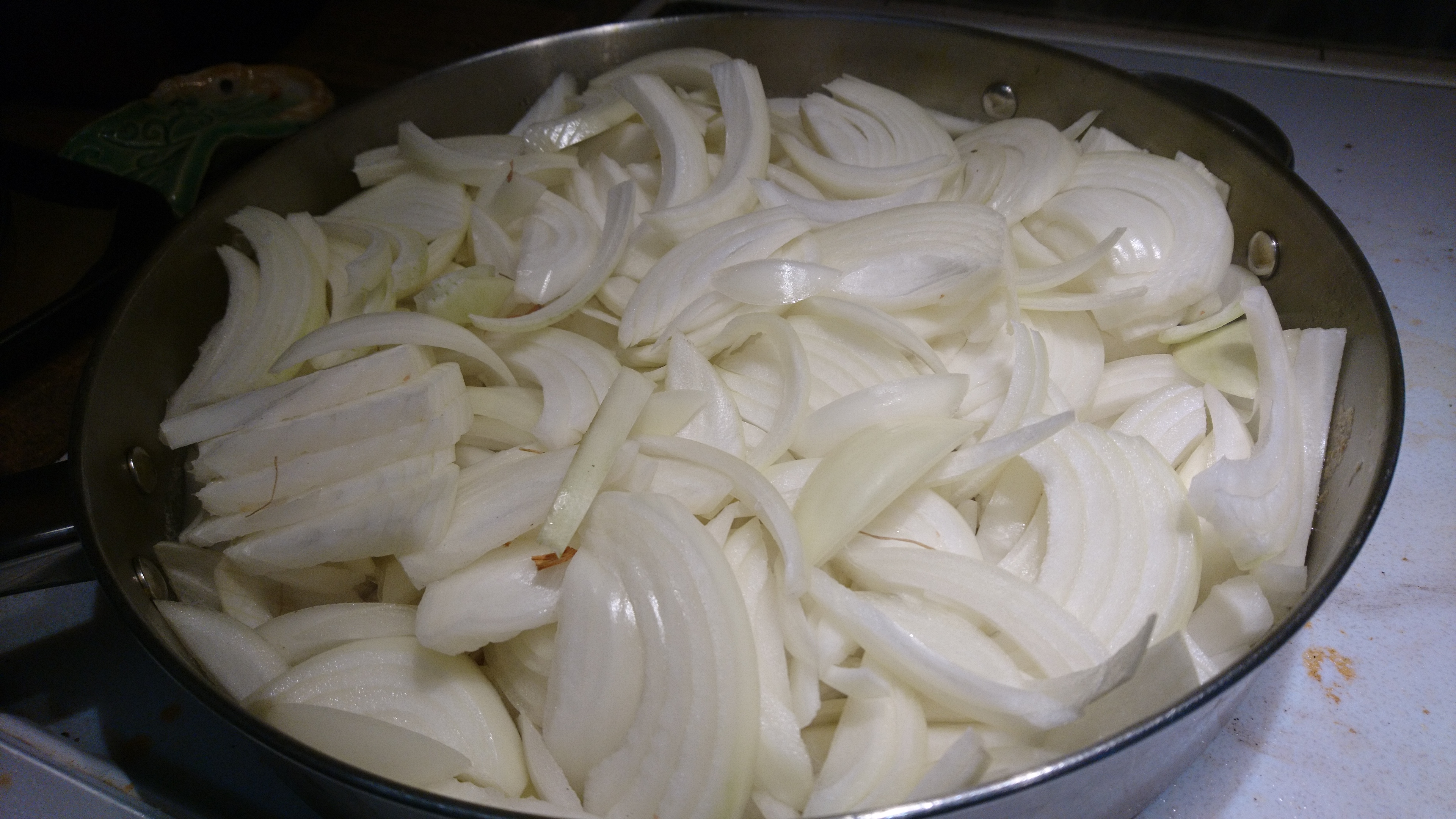 3.5 lbs of sliced onions in a big pan