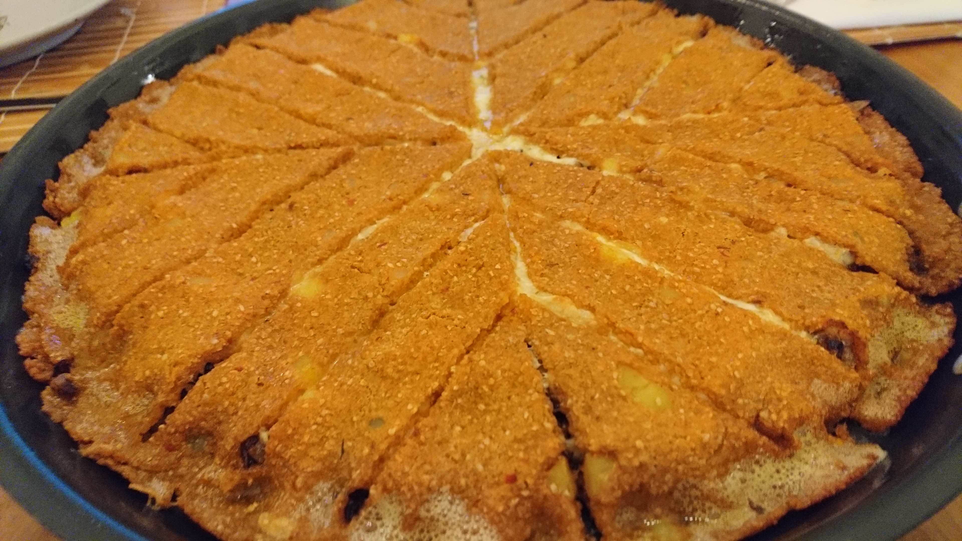 photo of cooked tray kibbeh, cut into stars and strips