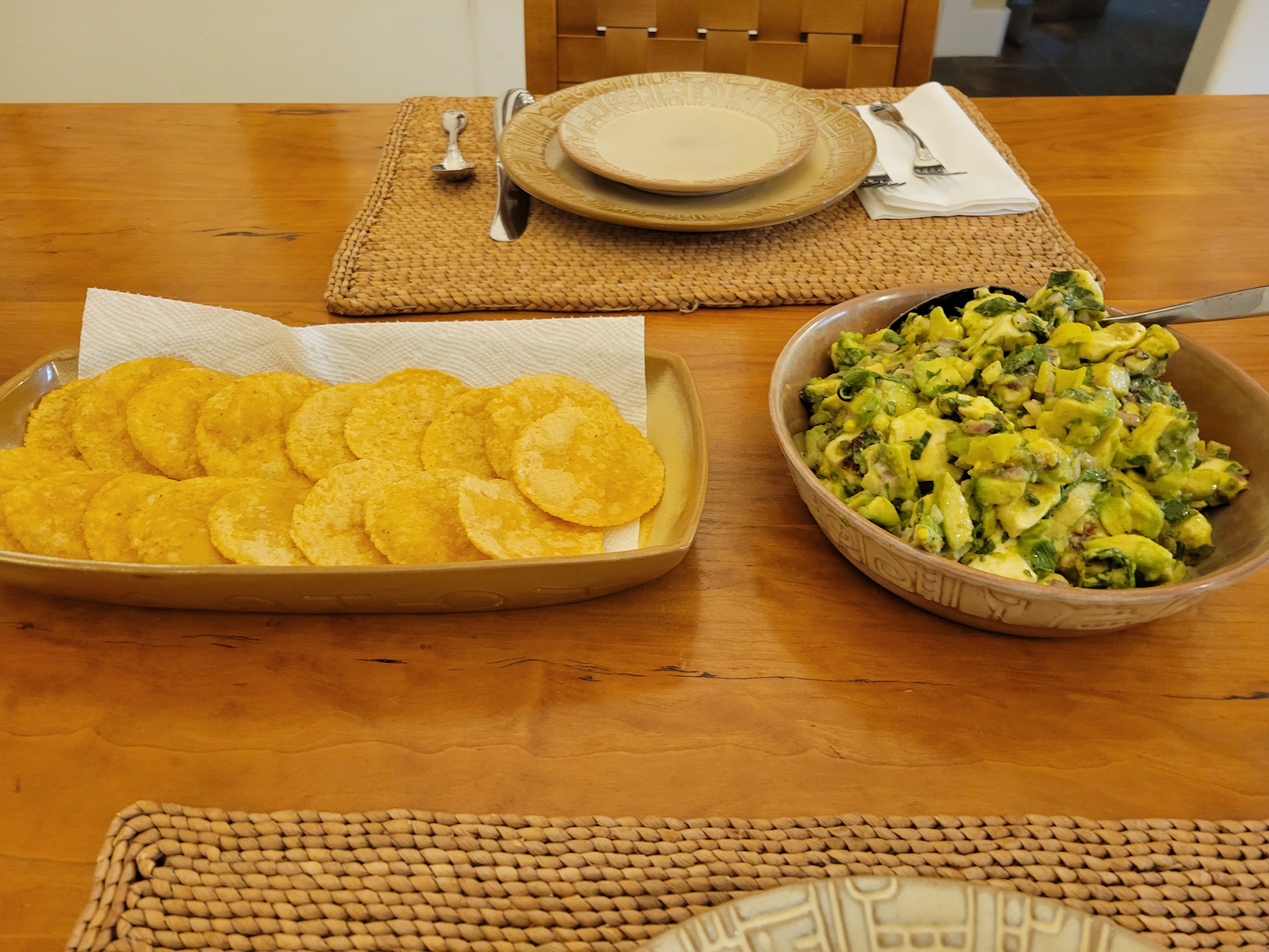 a bowl of avocado salad, next to a long plate with fried mini-tostadas.  In the background, you can see our seasonal Frankoma 