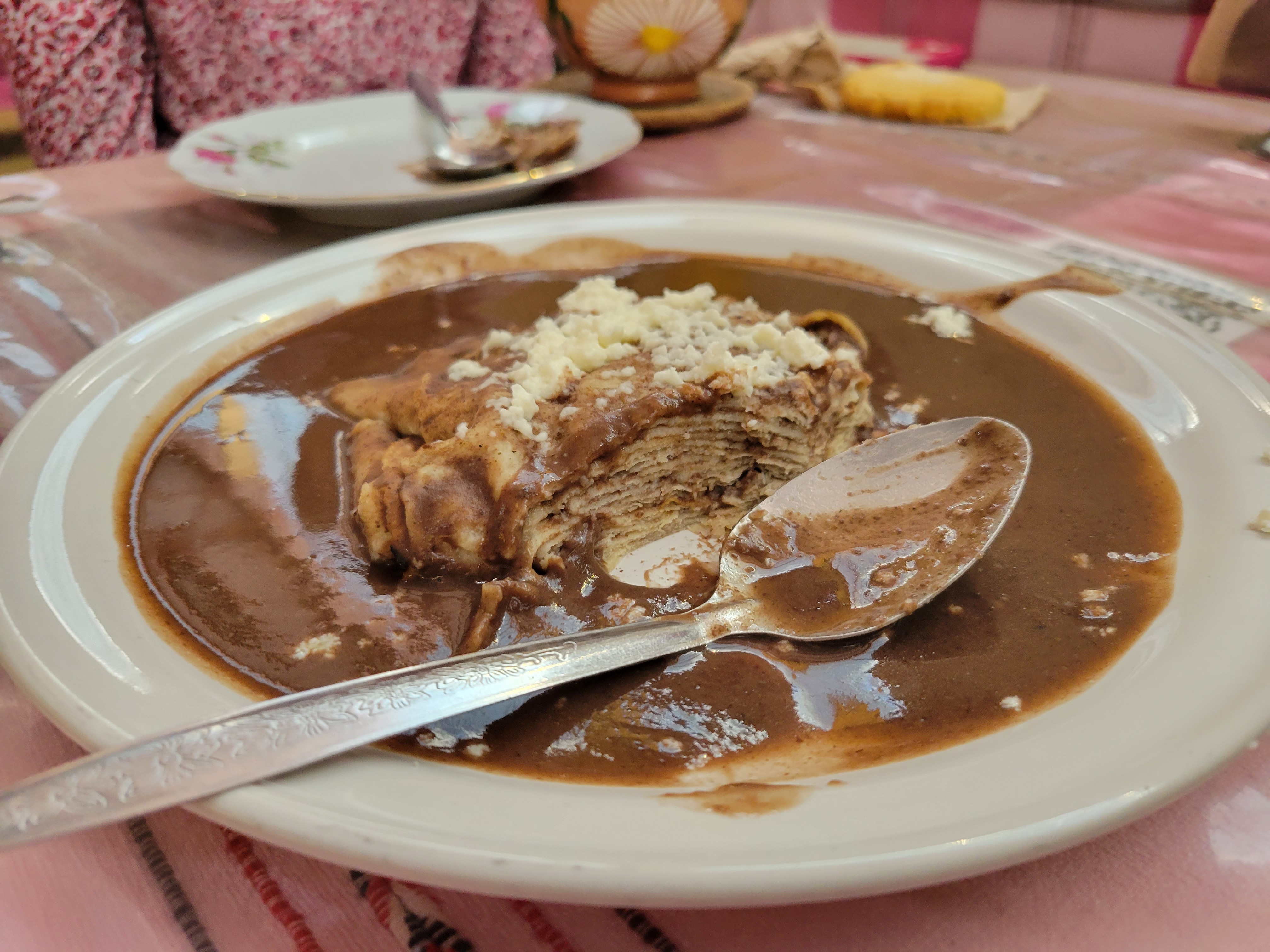 photo of a half-eaten plate of enfrijoladas from Mercado de la Merced, Oaxaca city