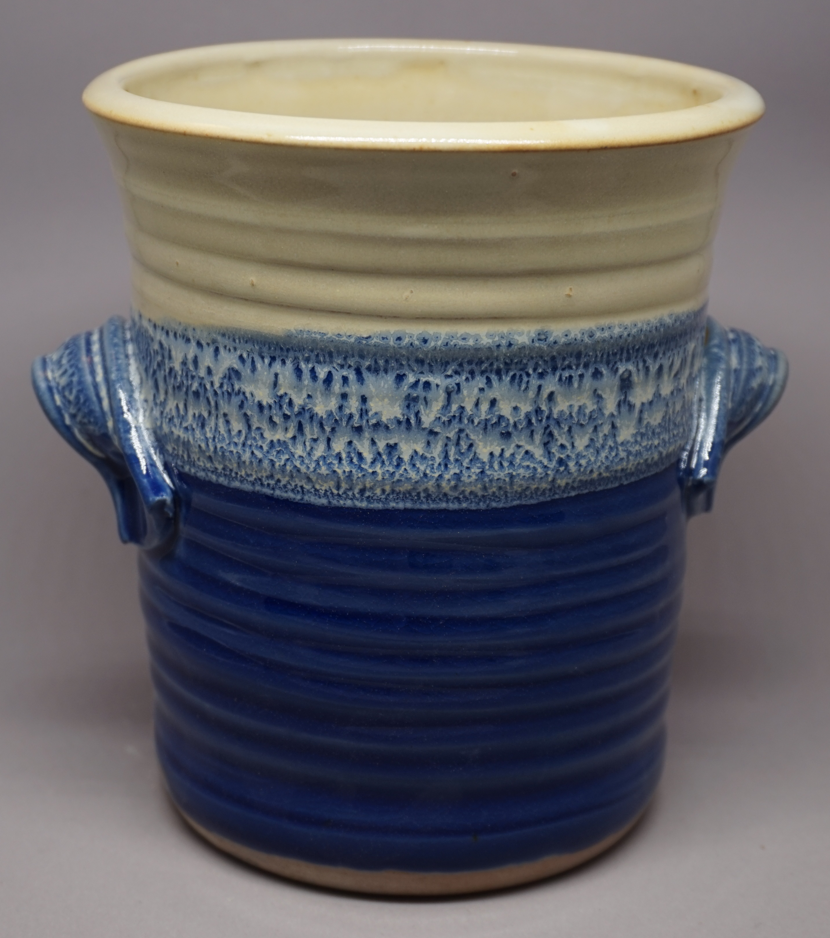 blue-and-yellow wine chiller with handles