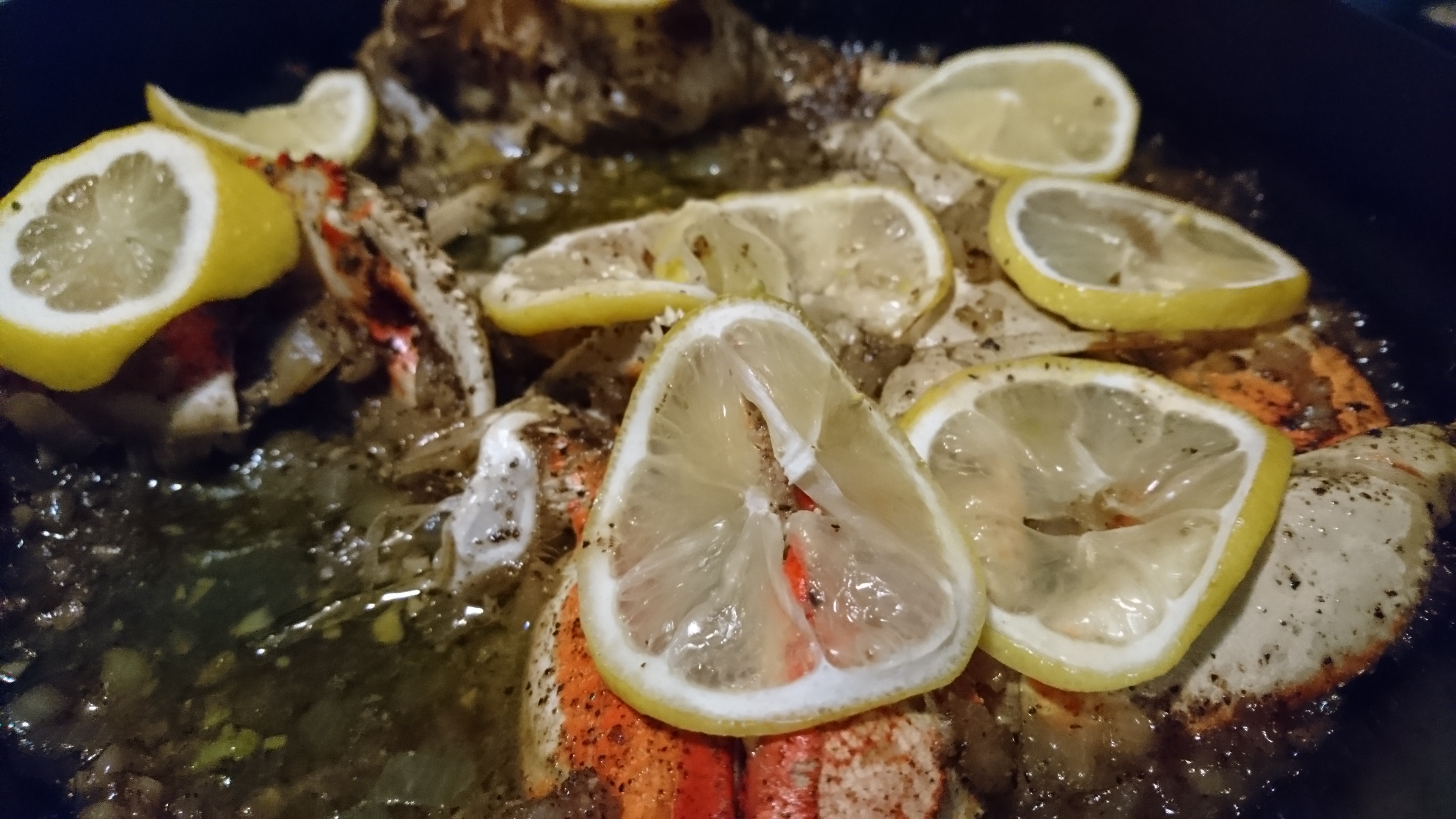 garlic-pepper crab in a cast iron skillet