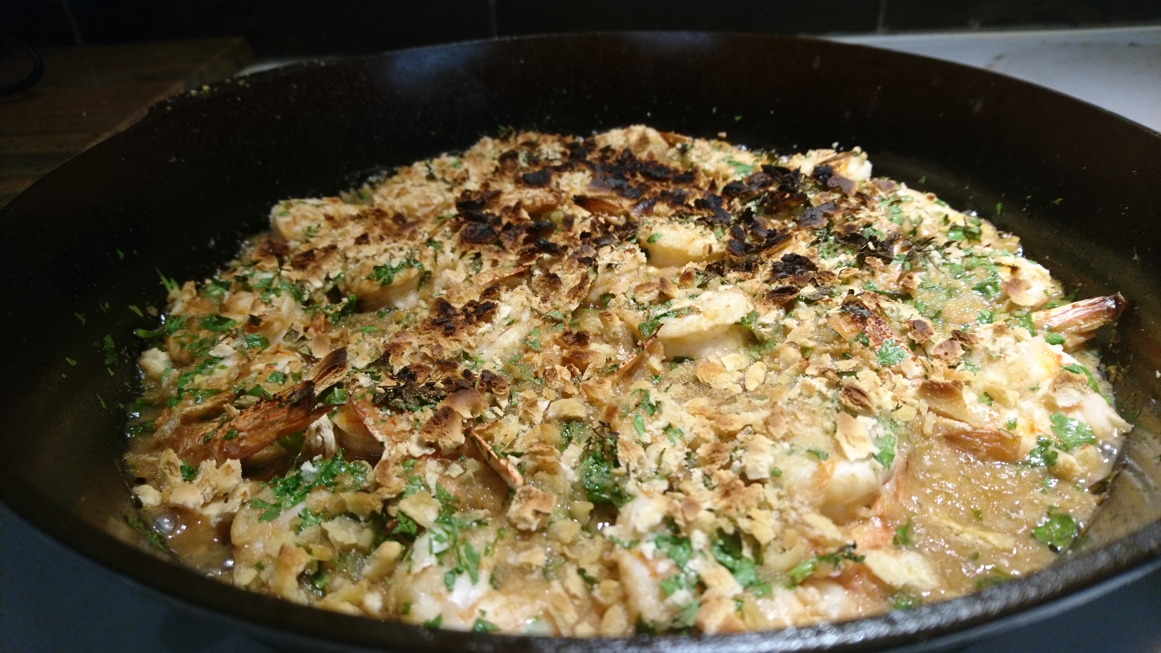 cast iron pan full of rummy shrimp