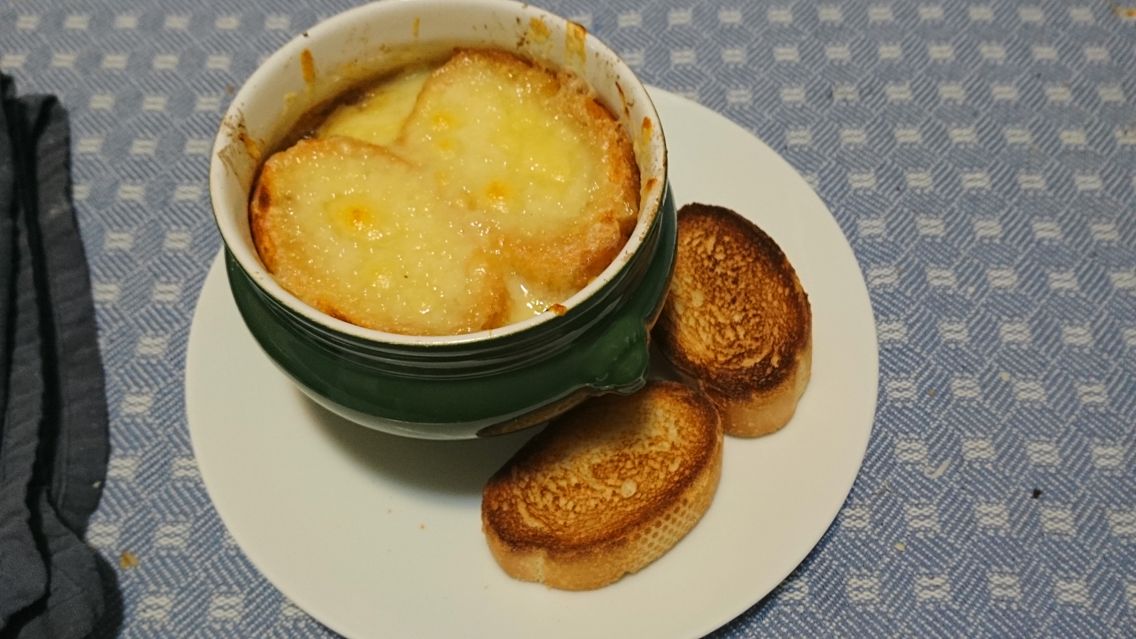 bowl of french onion soup with toasts
