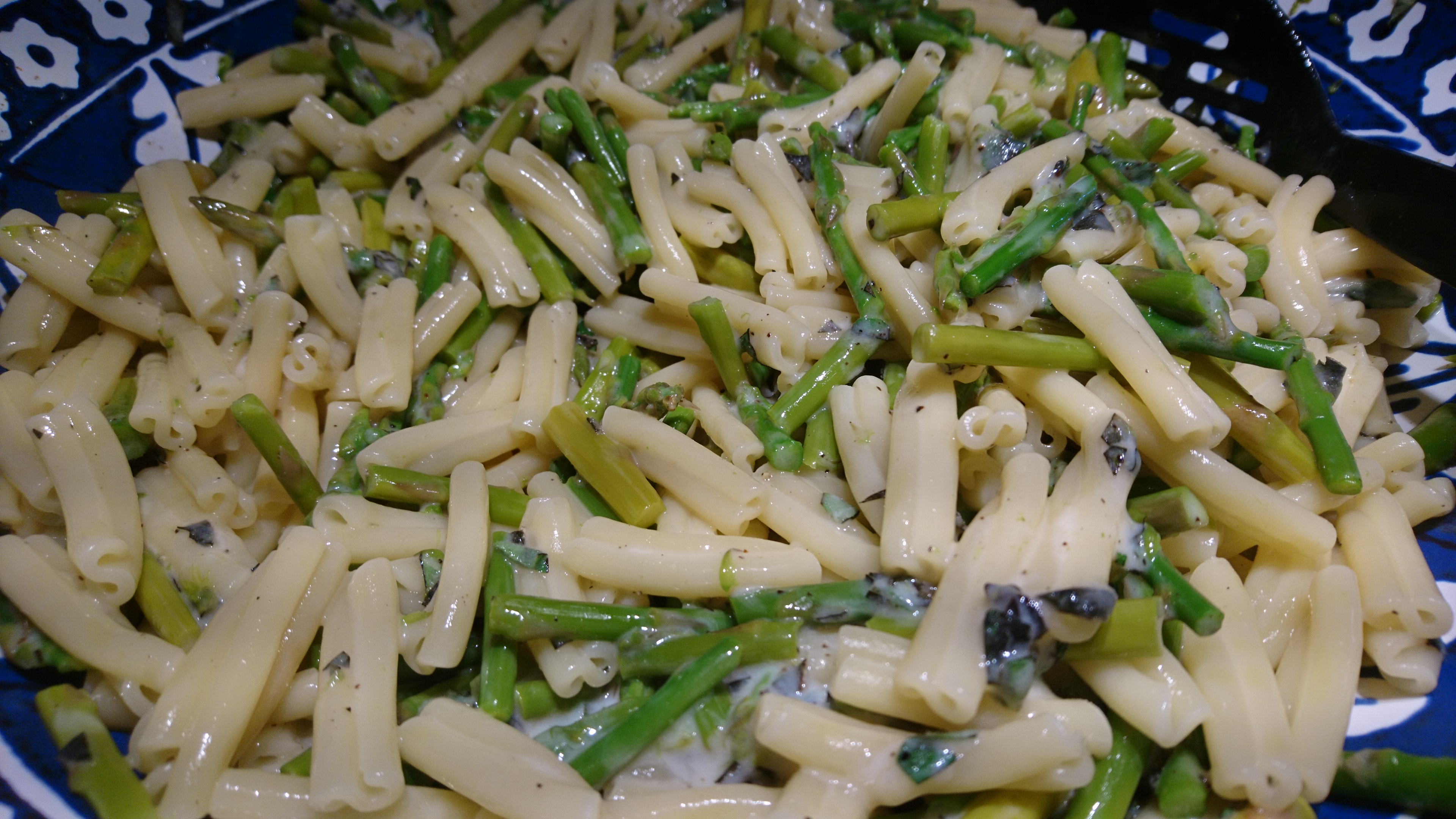 bowl of tossed taleggio/asparagus pasta
