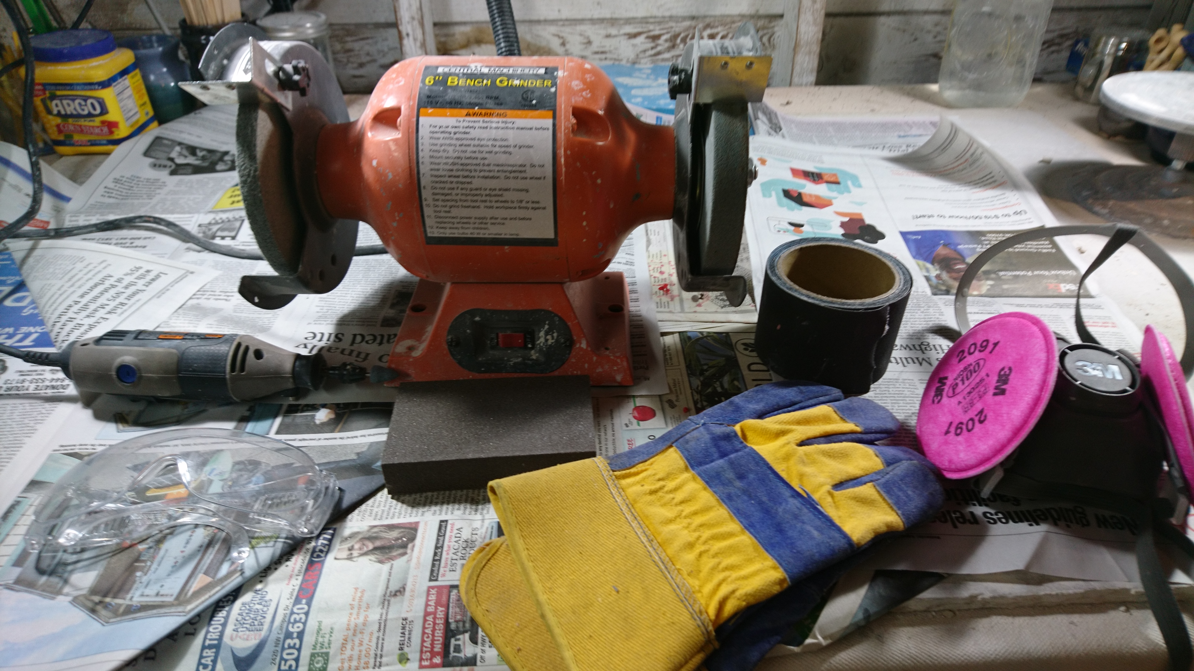 tools I use to smooth bottoms of pots, including bench grinder, sandpaper, dremel, etc.
