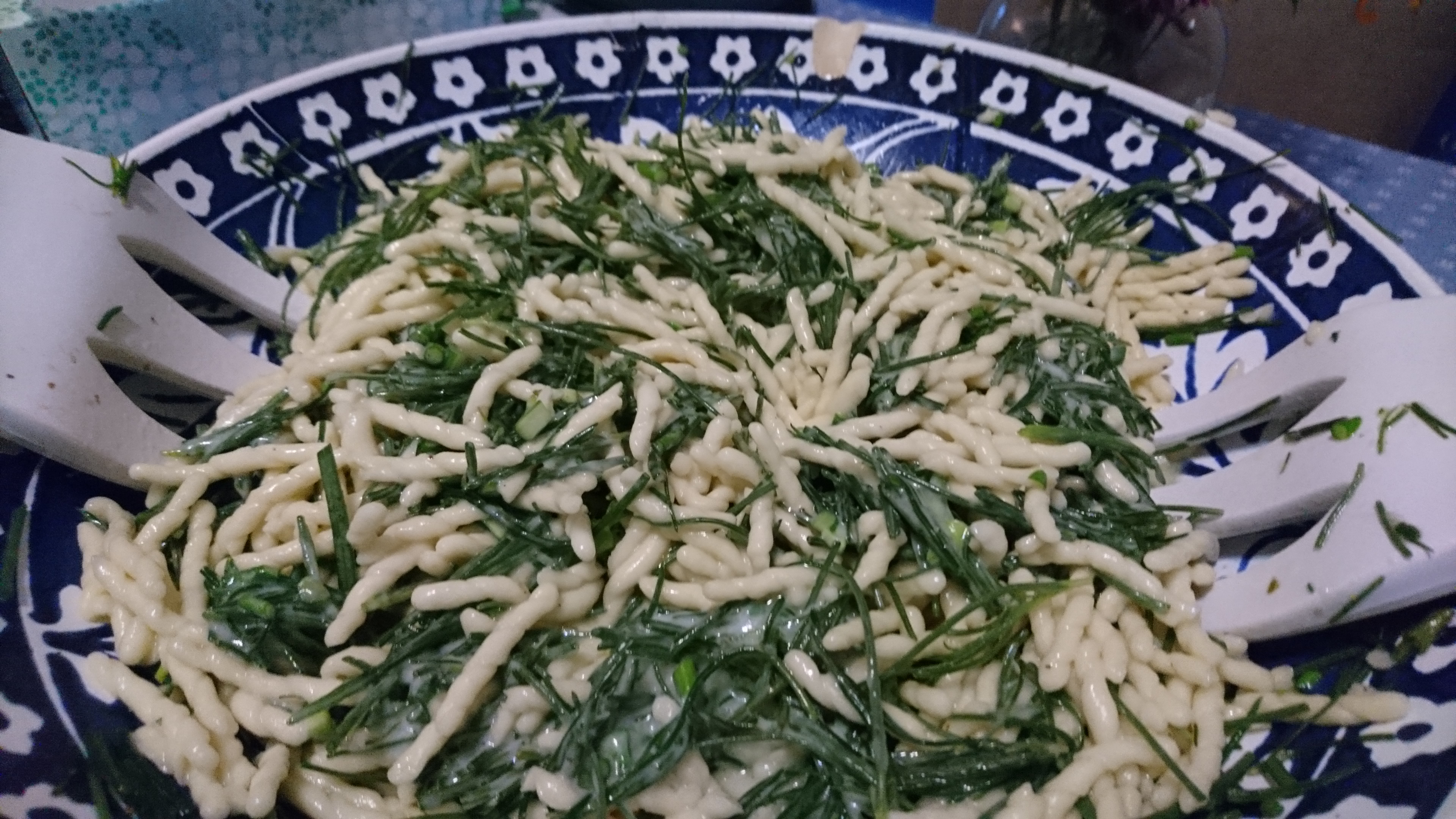 pasta bowl full of trofie with agretti ready to toss