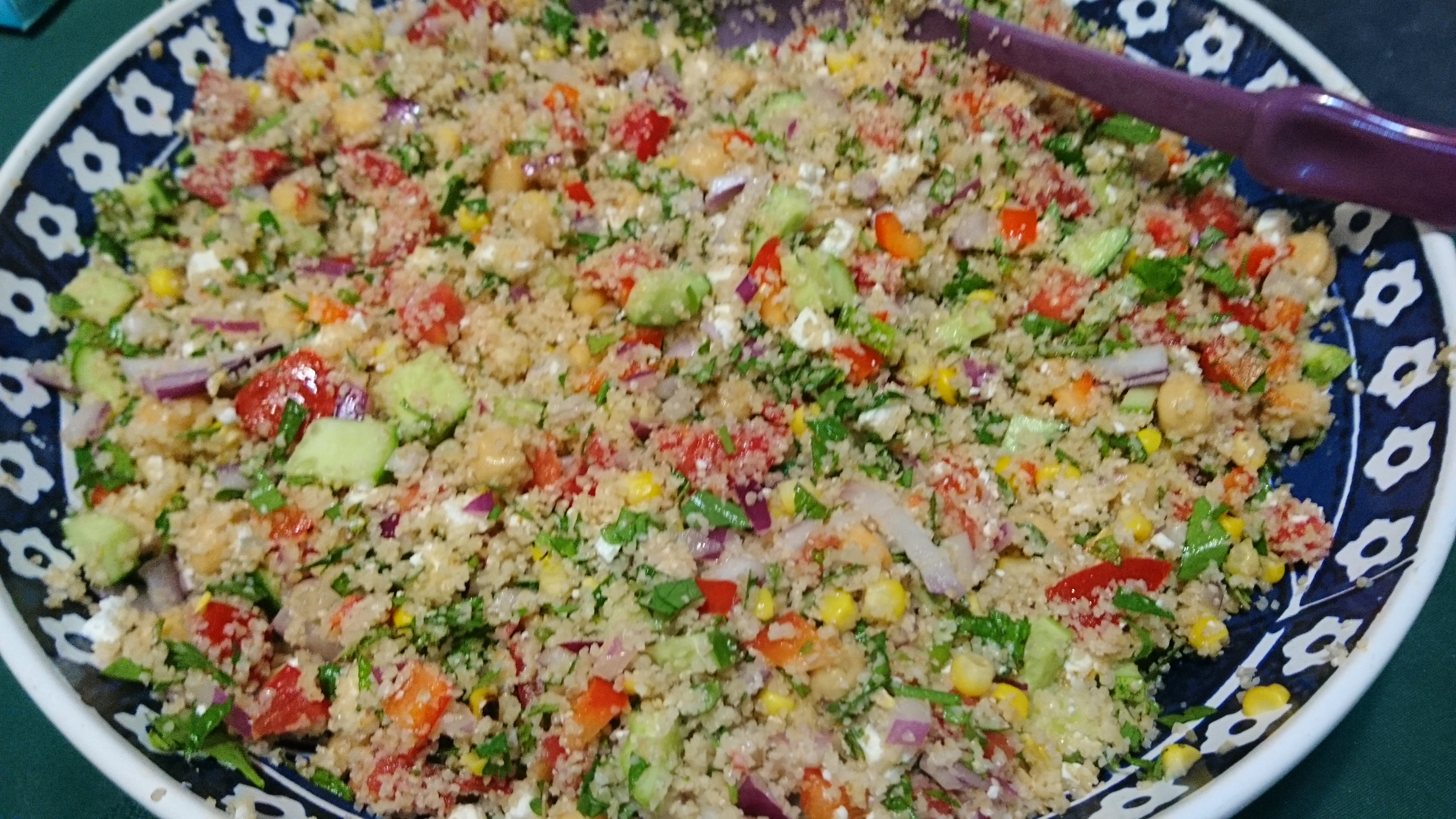 large bowl of tabouleh with many other veggies in it
