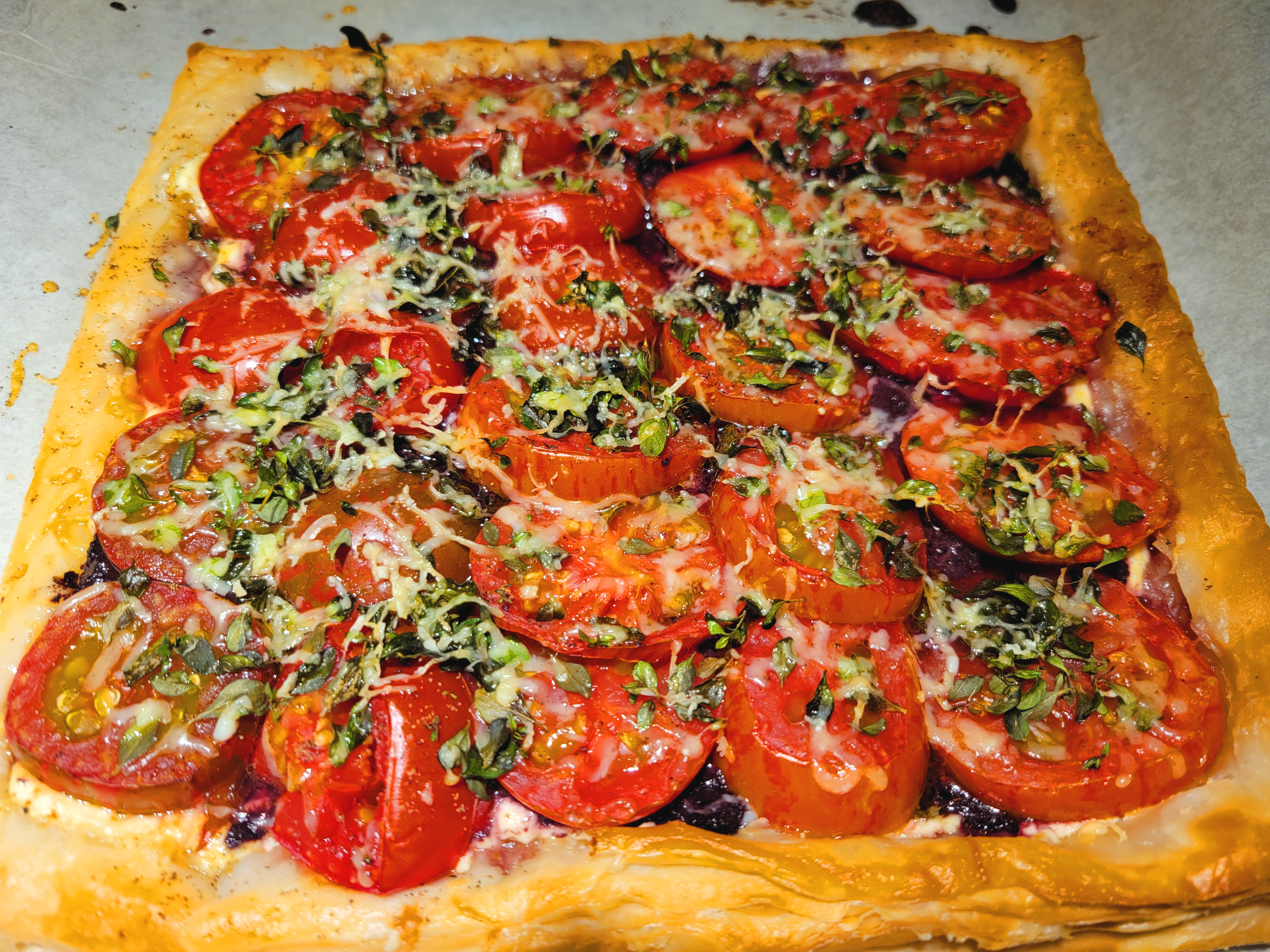 square puff pastry tart with sliced tomatoes